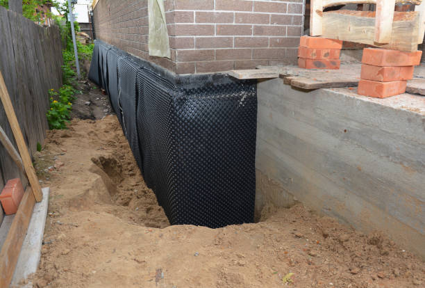 Happy homeowners after waterproofing job in Hornell